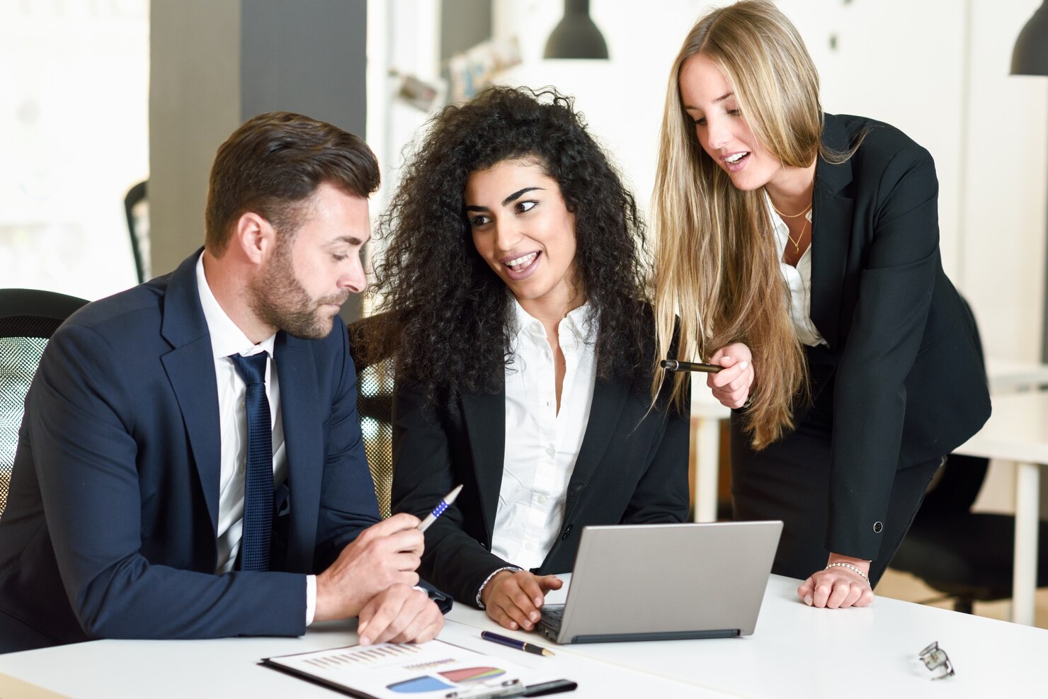 multi ethnic group three businesspeople meeting modern office two women caucasian man wearing suit looking laptop computer 1139 968